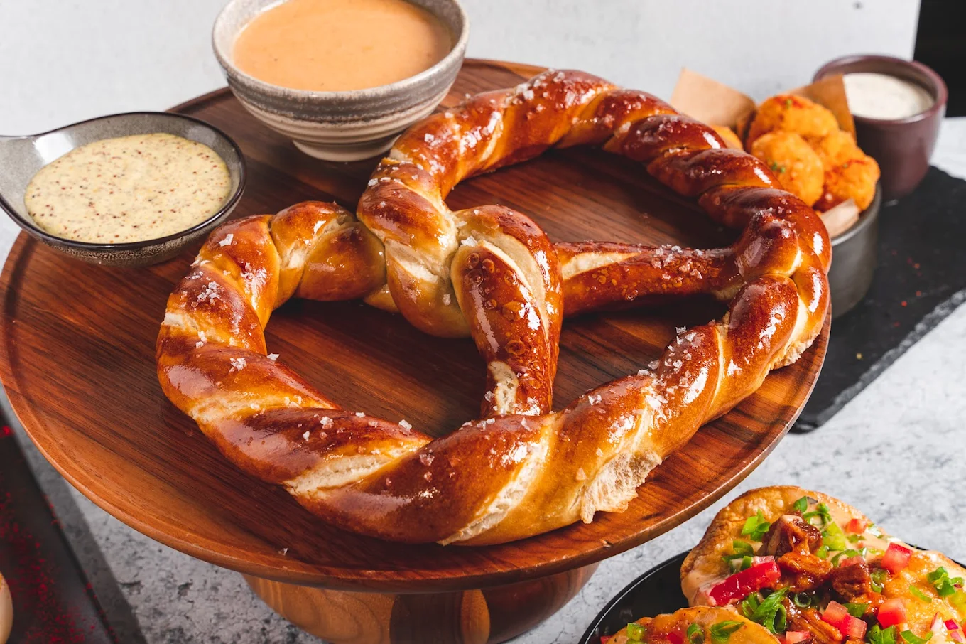 Giant soft pretzel with beer cheese and mustard