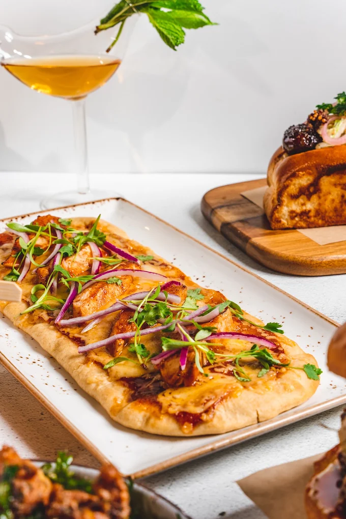 Chicken flatbread with red onion and micro herbs